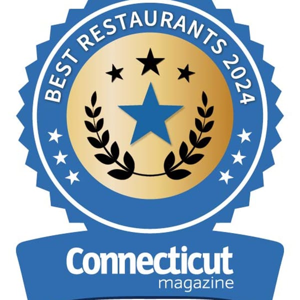 Blue and gold seal for "Best Restaurants 2024" by Connecticut Magazine, featuring stars and laurel.